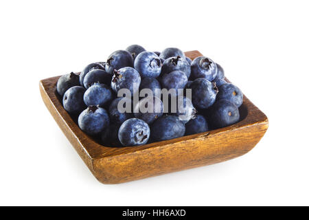 Blueberries in wooden bowl isolated on white background Stock Photo