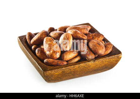 Raw cocoa beans in wooden bowl isolated on white background Stock Photo