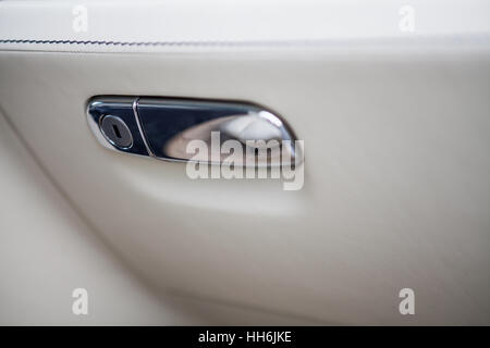 Color detail of the glove compartment in a luxury car. Stock Photo