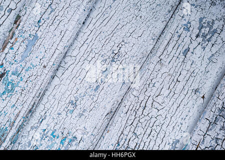 old wood board with chipped white and blue paint Stock Photo
