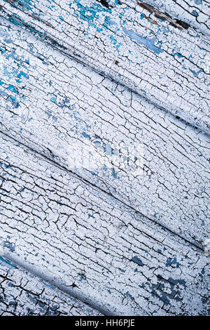 old wood board with peeling white and blue paint - vertical Stock Photo