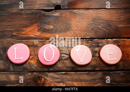 Word 'love'  from baked cookies for the day of Valentine with copy space Stock Photo