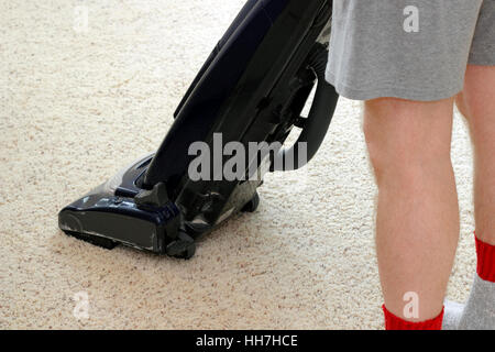 person, carpet, vacuum, cleaning, man, cleansing, legs, blue, humans, human Stock Photo
