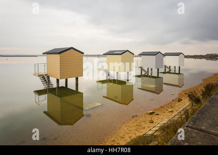 Beach Huts on Stilts near Maldon Essex Stock Photo
