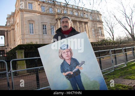 London UK. 17th January 2017.  Political satirist Kaya Mar stands  with a painting of British Prime Minister Theresa May depicted as a Police woman who prepares to deliver a historic speech at Lancaster House on Britain leaving the European Union following the referendum Credit: amer ghazzal/Alamy Live News