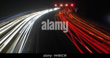 Hanover, Germany. 17th Jan, 2017. The photograph taken with a long exposure time shows light trails from vehicles on the Autobahn A2 motorway at the Lehrte exit in the region of Hanover, Germany, 17 January 2017. Photo: Julian Stratenschulte/dpa/Alamy Live News