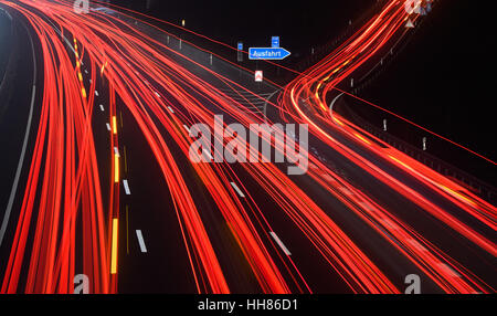 Hanover, Germany. 17th Jan, 2017. The photograph taken with a long exposure time shows light trails from vehicles on the Autobahn A2 motorway at the Lehrte exit in the region of Hanover, Germany, 17 January 2017. Photo: Julian Stratenschulte/dpa/Alamy Live News