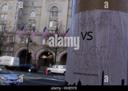 Washington DC, USA. 18th January 2017. A poster advertising the #DIsruptJ20 protest planned for the day of President-Elect Donald Trump's Inauguration, is seen across from the Trump International Hotel along Pennsylvania Avenue in Washington, D.C., Wednesday, January 18, 2017. Credit: Michael Candelori/Alamy Live News Stock Photo