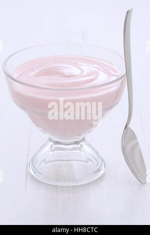 Delicious, nutritious and healthy fresh strawberry yogurt on vintage wood. Stock Photo