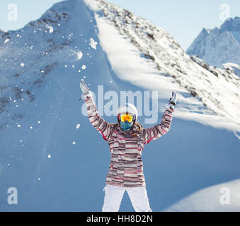 Female snowboarder  in the alpine mountains Stock Photo