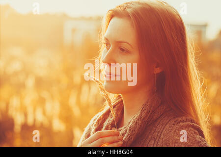 Young woman outdoors autumn sunny portrait Stock Photo