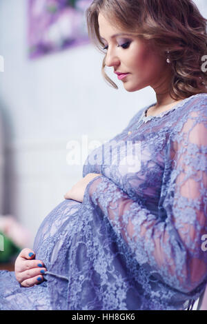 Young pregnant woman indoors portrait Stock Photo