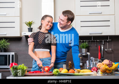 Young couple having fun in the kitchen Stock Photo