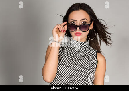 Young woman wearing sunglasses, portrait, fashion, lifestyle Stock Photo