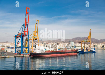 Massive freighter at an industrial dock in Malaga Spain Stock Photo