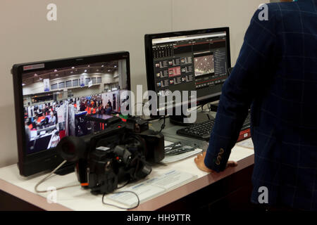Computer workstation showing video editing software on screen - USA Stock Photo