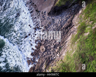 Cornish cliffside with rocks aerial photo Stock Photo