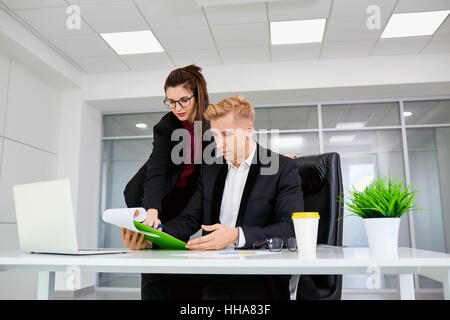 Two businessman working at his desk in the office Stock Photo