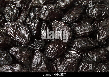 Bunch of dry plums forming a background Stock Photo