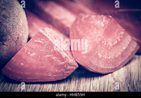 Sliced red beet on wooden surface Stock Photo