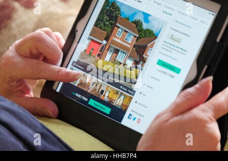 online property search using tablet computer Stock Photo
