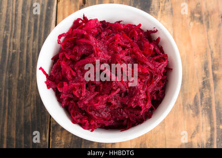 Fresh Grated Beet Salad on Rustic Wooden Background. Stock Photo