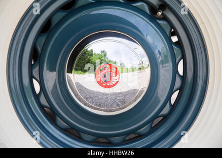 1936 Scarab minivan automobile hubcap with the Scarab logo, designed by William Stout. Stock Photo