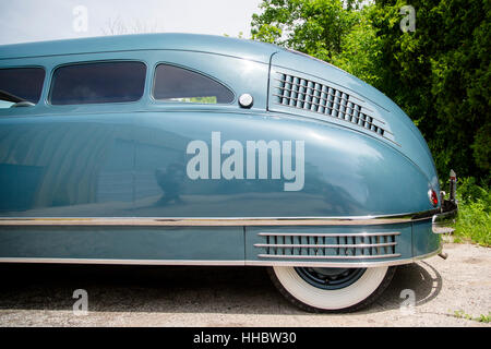 A detail of the back end of a 1936 Scarab minivan automobile, designed by William Stout. Stock Photo