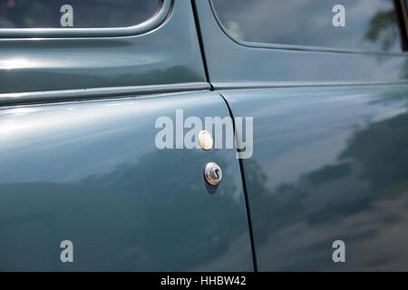 A detail of the push button door on the1936 Scarab minivan automobile, designed by William Stout. Stock Photo