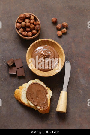 Chocolate paste spread with hazelnuts and bread for breakfast Stock Photo