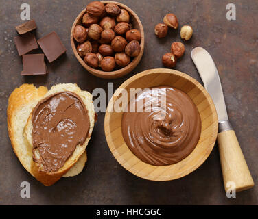 Chocolate paste spread with hazelnuts and bread for breakfast Stock Photo