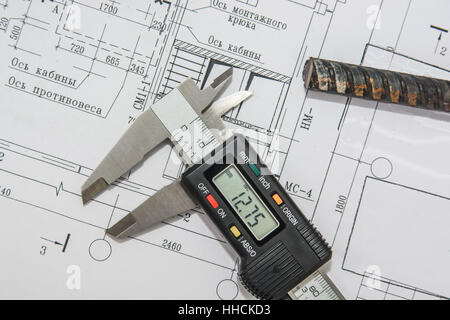 Man holding blueprints at construction site Stock Photo