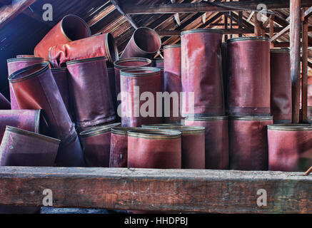 Photo from demolition  textile  factory,barrels under roof Stock Photo