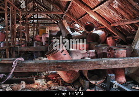 Photo from demolition  textile  factory,barrels under roof. Stock Photo