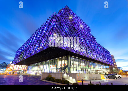 The Library of Birmingham, illuminated at night, Centenary Square, Birmingham, UK Stock Photo