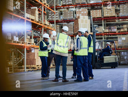 Manager and workers meeting in distribution warehouse Stock Photo