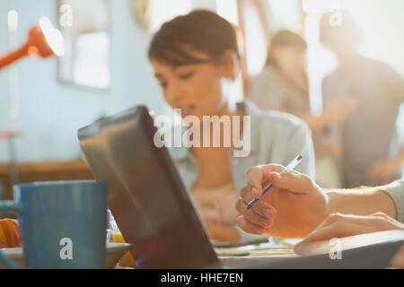 Young man and woman college students studying using laptop Stock Photo