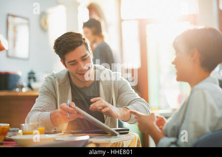 Young couple college students studying using digital tablet Stock Photo