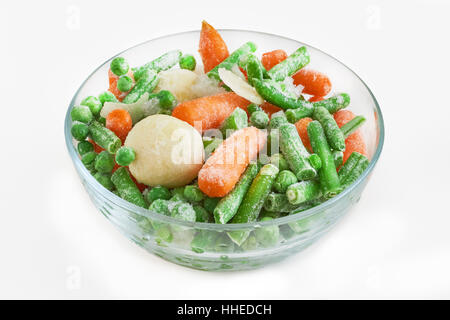 Frozen vegetables in glass bowl isolated on white background Stock Photo