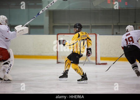 Moscow, Russia - January, 07, 2017: Amateur hockey league LHL-77. Game between hockey team 'New Jersey 53' and hockey team 'Reds'. Stock Photo