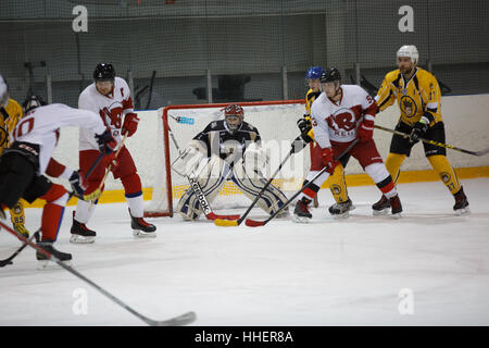 Moscow, Russia - January, 07, 2017: Amateur hockey league LHL-77. Game between hockey team 'New Jersey 53' and hockey team 'Reds'. Stock Photo