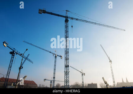 constructions cranes on sky background Stock Photo