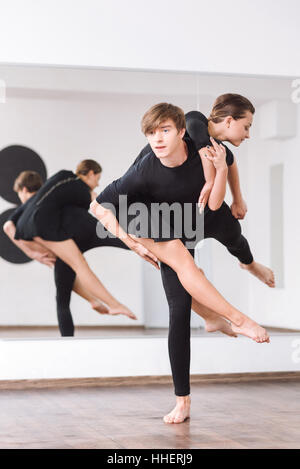 Good looking strong man practicing ballet dancing Stock Photo