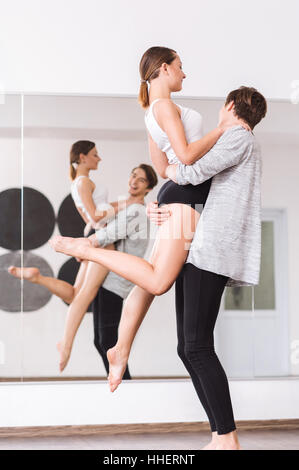 Cheerful nice dancers practicing ballet dancing Stock Photo