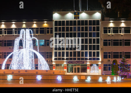 Anapa, Russia - January 7, 2017: Night view of the administration of the city of Anapa resort and the fountain in the New Year's holidays Stock Photo