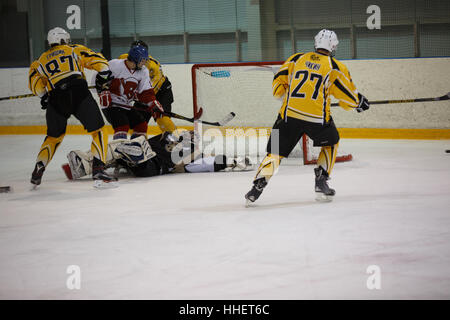 Moscow, Russia - January, 07, 2017: Amateur hockey league LHL-77. Game between hockey team 'New Jersey 53' and hockey team 'Reds'. Stock Photo