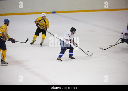 Moscow, Russia - January, 07, 2017: Amateur hockey league LHL-77. Game between hockey team 'New Jersey 53' and hockey team 'Reds'. Stock Photo