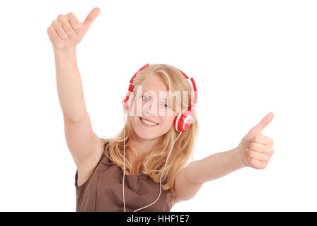 Pretty teenage girl listening music on her headphones isolated on white background Stock Photo