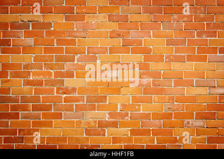 Background of old red and dotted brick wall texture, abstract architecture wallpaper Stock Photo