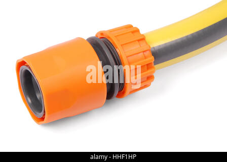 Yellow garden water hose and orange nozzle, isolated on white background with soft shadow Stock Photo